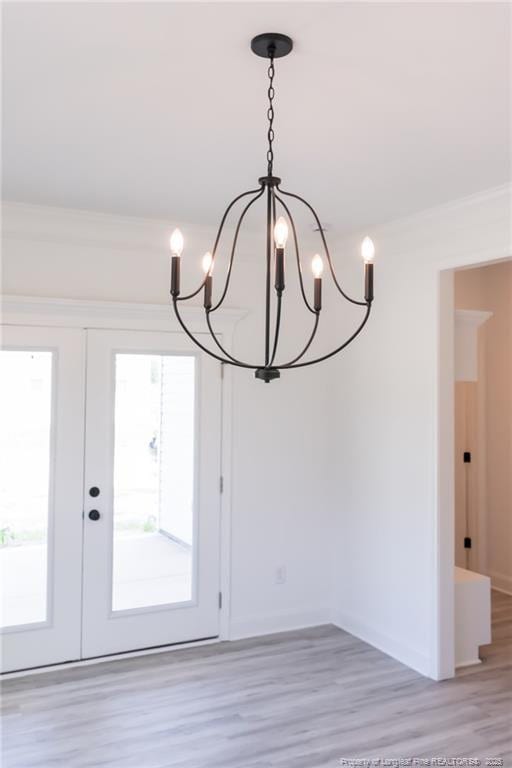 00 John B Carter Rd, Fayetteville, NC 28312 - unfurnished dining area featuring a chandelier, light wood-style floors, french doors, and healthy amount of natural light