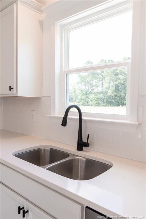 00 John B Carter Rd, Fayetteville, NC 28312 - kitchen view of a sink, white cabinetry, and light countertops