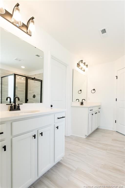 00 John B Carter Rd, Fayetteville, NC 28312 - full bathroom with a shower stall and two vanities