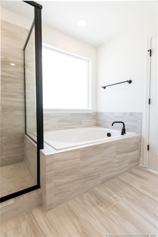 00 John B Carter Rd, Fayetteville, NC 28312 - full bath featuring a garden tub, a stall shower, and tile patterned flooring