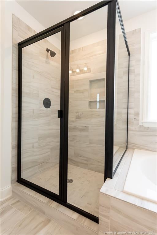 00 John B Carter Rd, Fayetteville, NC 28312 - bathroom featuring a stall shower and a garden tub