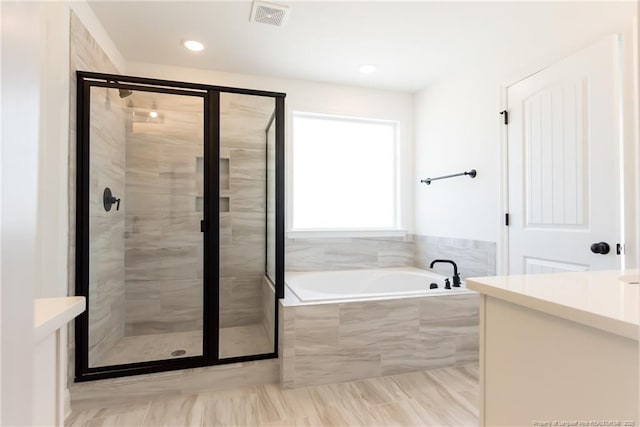 00 John B Carter Rd, Fayetteville, NC 28312 - full bath with a stall shower, a garden tub, vanity, and recessed lighting