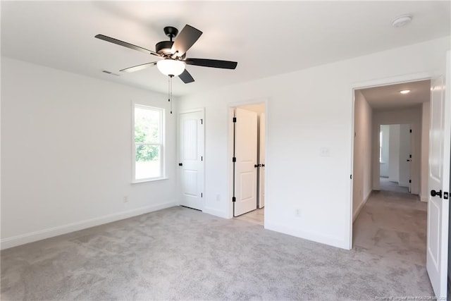 00 John B Carter Rd, Fayetteville, NC 28312 - unfurnished bedroom with light colored carpet, baseboards, and a ceiling fan