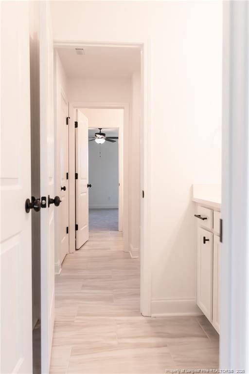 00 John B Carter Rd, Fayetteville, NC 28312 - corridor with baseboards and light wood-style flooring