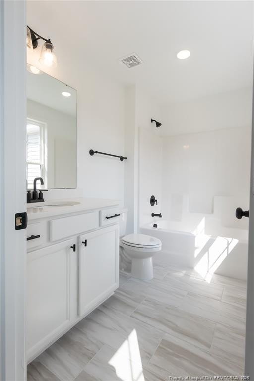 00 John B Carter Rd, Fayetteville, NC 28312 - bathroom featuring bathing tub / shower combination, vanity, and toilet