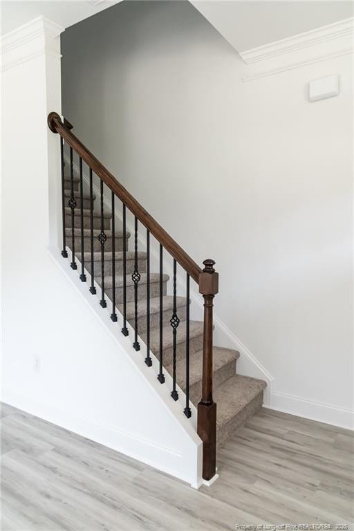 00 John B Carter Rd, Fayetteville, NC 28312 - stairs featuring wood finished floors, baseboards, and ornamental molding