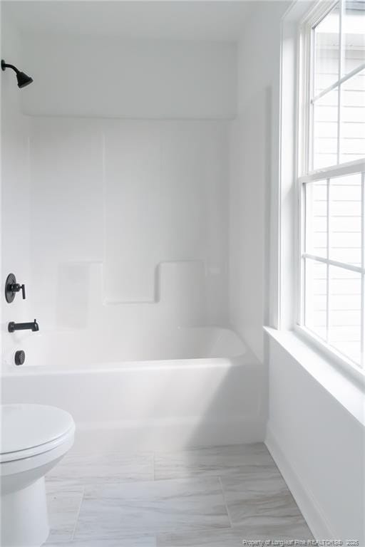 00 John B Carter Rd, Fayetteville, NC 28312 - bathroom featuring toilet,  shower combination, and baseboards
