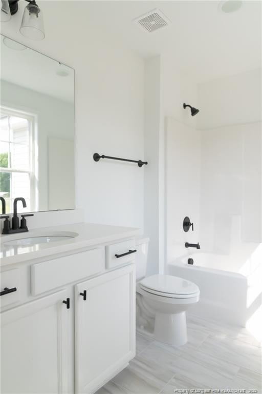 00 John B Carter Rd, Fayetteville, NC 28312 - bathroom with toilet, vanity, and bathtub / shower combination
