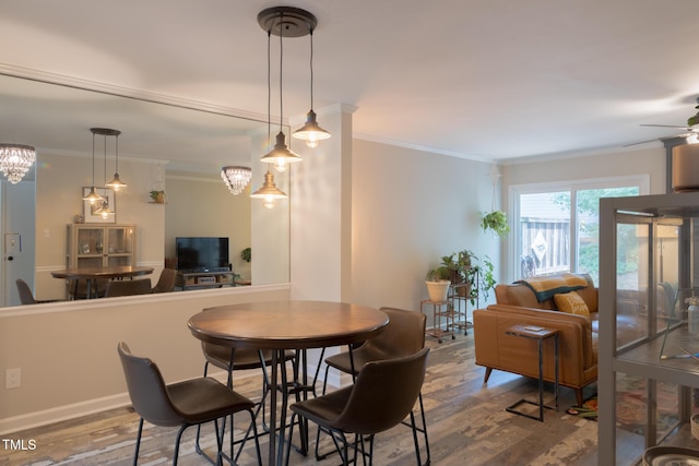 5514 Oldtowne Rd, Raleigh, NC 27612 - dining space featuring wood finished floors, ornamental molding, and a ceiling fan