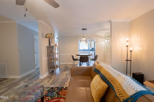 5514 Oldtowne Rd, Raleigh, NC 27612 - living room with wood finished floors, a ceiling fan, baseboards, and ornamental molding