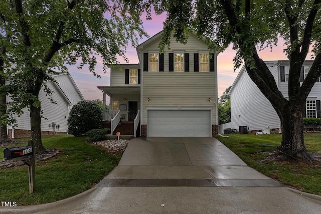 109 Troyer Pl, Apex, NC 27502 - traditional-style home featuring a garage, brick siding, a front lawn, and concrete driveway