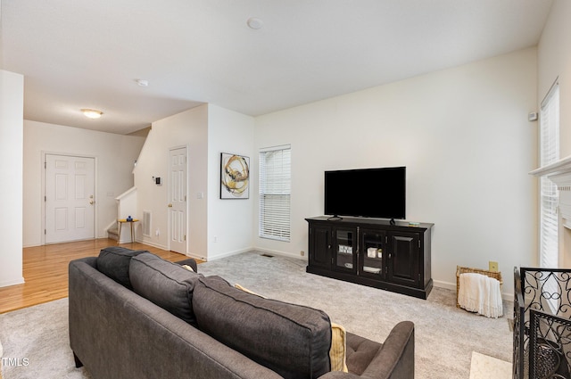109 Troyer Pl, Apex, NC 27502 - living area with carpet floors, stairs, and baseboards