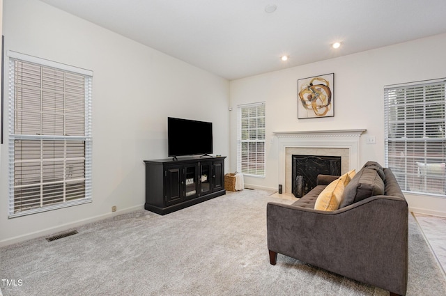 109 Troyer Pl, Apex, NC 27502 - carpeted living area with baseboards, recessed lighting, a high end fireplace, and plenty of natural light