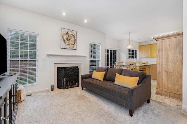 109 Troyer Pl, Apex, NC 27502 - living room featuring light colored carpet, recessed lighting, a high end fireplace, and baseboards