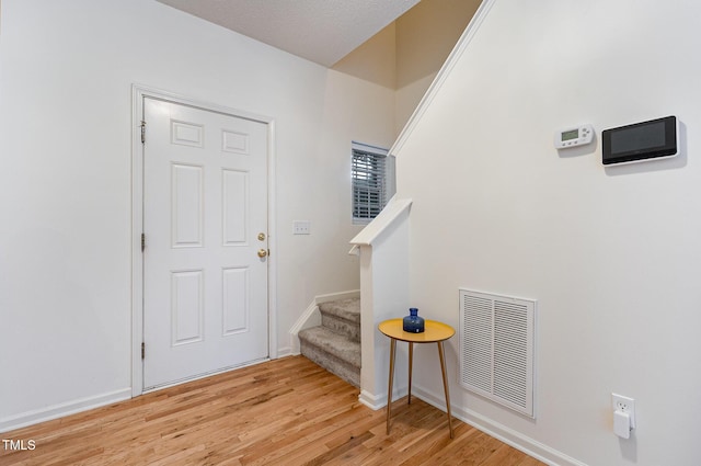 109 Troyer Pl, Apex, NC 27502 - foyer entrance featuring stairway, light wood-style floors, and baseboards