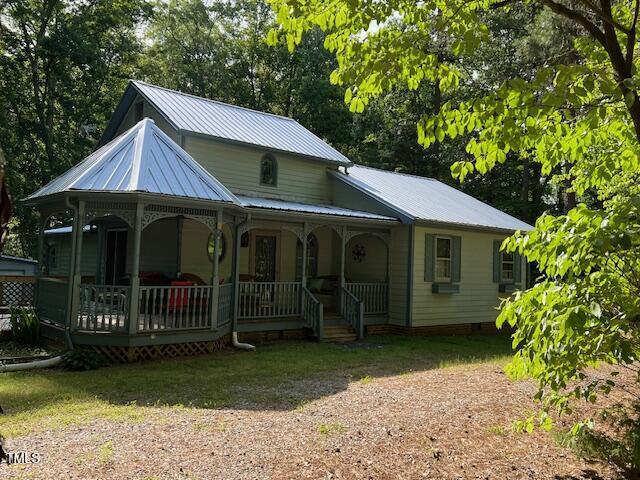 358 Pool Rock Shores Ln, Henderson, NC 27537 - view of front of house with covered porch and metal roof