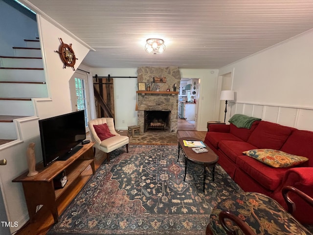 358 Pool Rock Shores Ln, Henderson, NC 27537 - living room featuring wood finished floors, stairway, and a barn door
