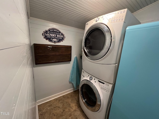 358 Pool Rock Shores Ln, Henderson, NC 27537 - laundry area featuring stacked washer and clothes dryer, baseboards, wood walls, and wooden ceiling