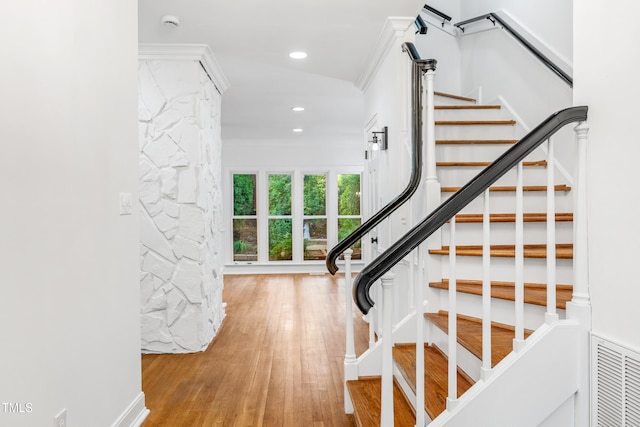 2205 Landings Way, Raleigh, NC 27615 - stairway featuring wood finished floors, recessed lighting, and crown molding