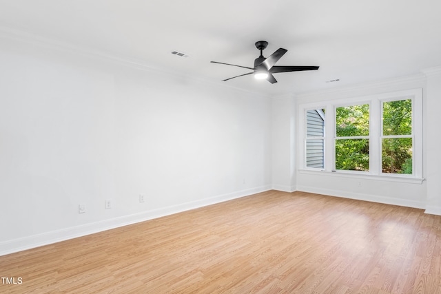 2205 Landings Way, Raleigh, NC 27615 - empty room with ornamental molding, baseboards, light wood-style floors, and a ceiling fan