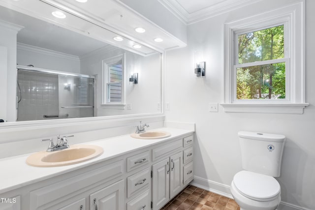 2205 Landings Way, Raleigh, NC 27615 - bathroom featuring ornamental molding, double vanity, a shower with shower door, baseboards, and toilet