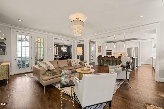 129 Ruskin Dr, Chapel Hill, NC 27516 - living room with crown molding, a chandelier, dark wood-type flooring, recessed lighting, and baseboards