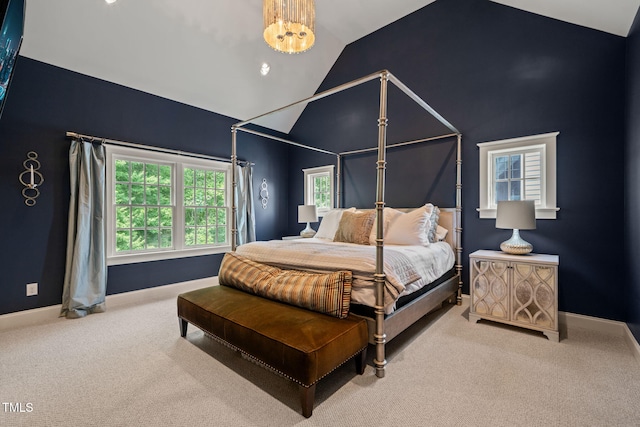 129 Ruskin Dr, Chapel Hill, NC 27516 - bedroom with vaulted ceiling, carpet floors, baseboards, and a chandelier