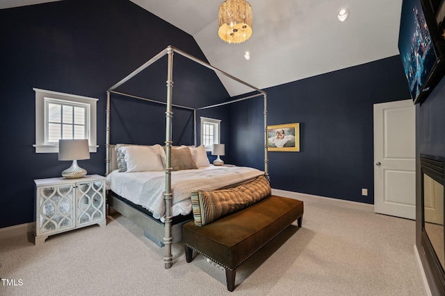 129 Ruskin Dr, Chapel Hill, NC 27516 - bedroom featuring lofted ceiling, carpet floors, multiple windows, and baseboards