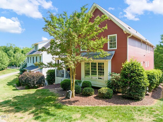 129 Ruskin Dr, Chapel Hill, NC 27516 - view of front of house with a front lawn