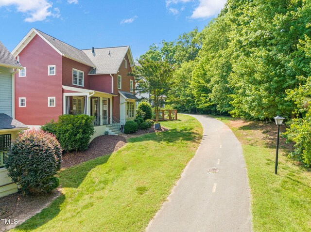 129 Ruskin Dr, Chapel Hill, NC 27516 - view of front facade with a front lawn