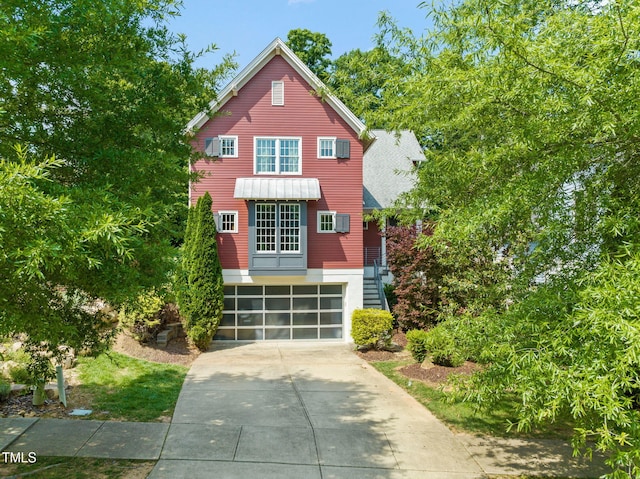 129 Ruskin Dr, Chapel Hill, NC 27516 - view of front facade with driveway and a garage