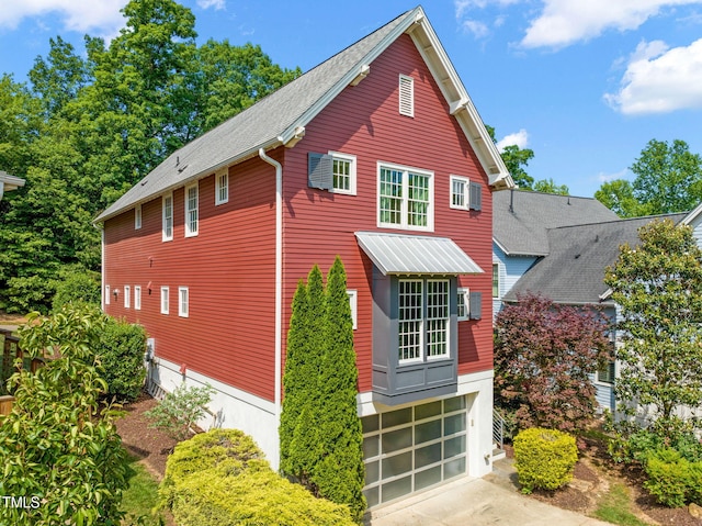 129 Ruskin Dr, Chapel Hill, NC 27516 - view of home's exterior featuring a garage and concrete driveway