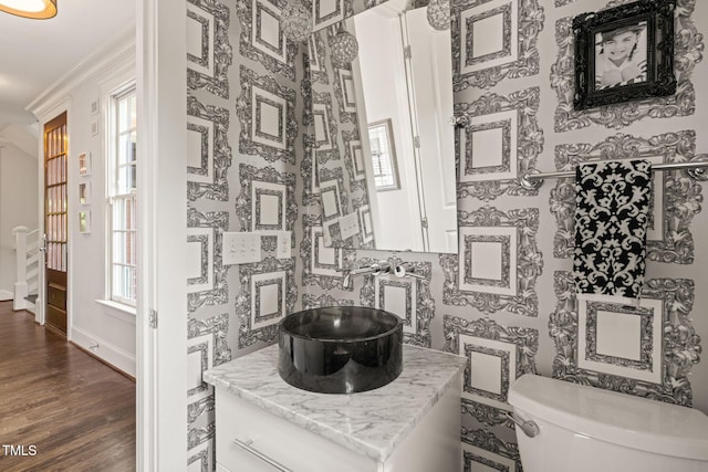 129 Ruskin Dr, Chapel Hill, NC 27516 - bathroom with toilet, wood finished floors, crown molding, vanity, and baseboards