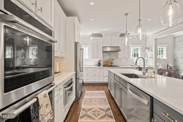 129 Ruskin Dr, Chapel Hill, NC 27516 - kitchen featuring appliances with stainless steel finishes, a sink, gray cabinets, decorative backsplash, and recessed lighting