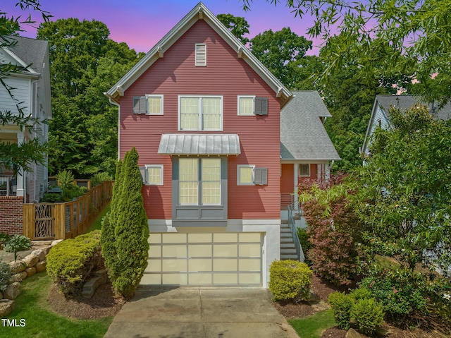 129 Ruskin Dr, Chapel Hill, NC 27516 - view of front of house featuring driveway, stairs, and a garage