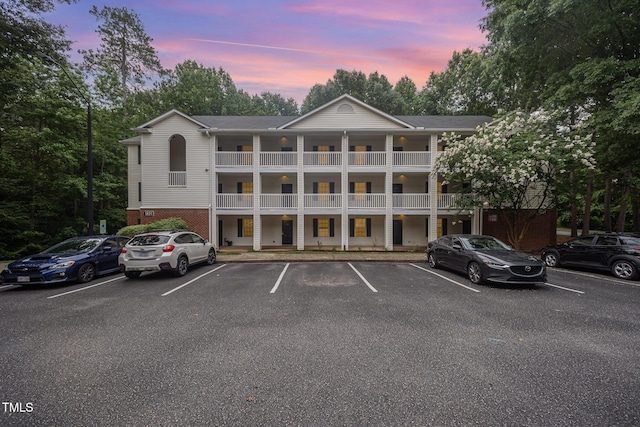 1851 Trailwood Heights Ln Unit 204, Raleigh, NC 27603 - property at dusk featuring uncovered parking