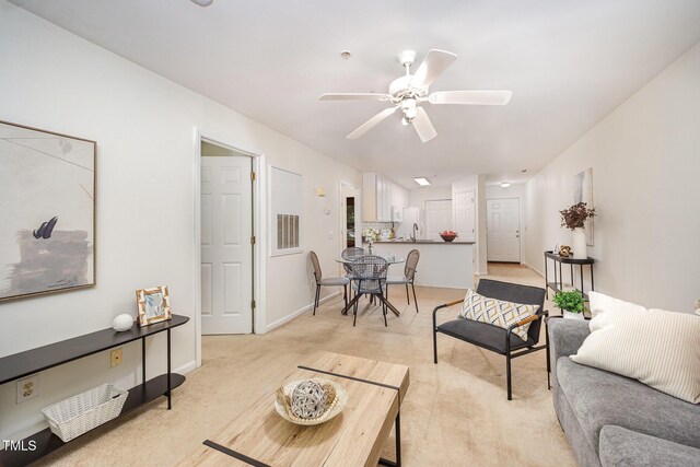 1851 Trailwood Heights Ln Unit 204, Raleigh, NC 27603 - living area featuring a ceiling fan and light colored carpet