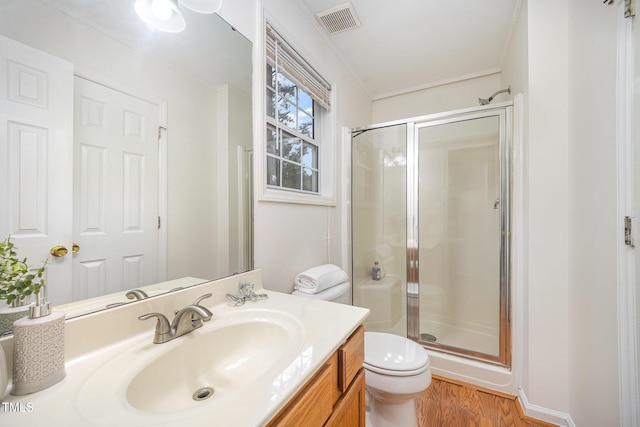 1851 Trailwood Heights Ln Unit 204, Raleigh, NC 27603 - bathroom with a shower stall, wood finished floors, and vanity