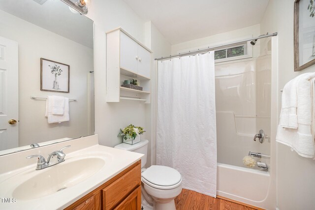 1851 Trailwood Heights Ln Unit 204, Raleigh, NC 27603 - full bathroom featuring vanity, wood finished floors, and shower / bath combination with curtain