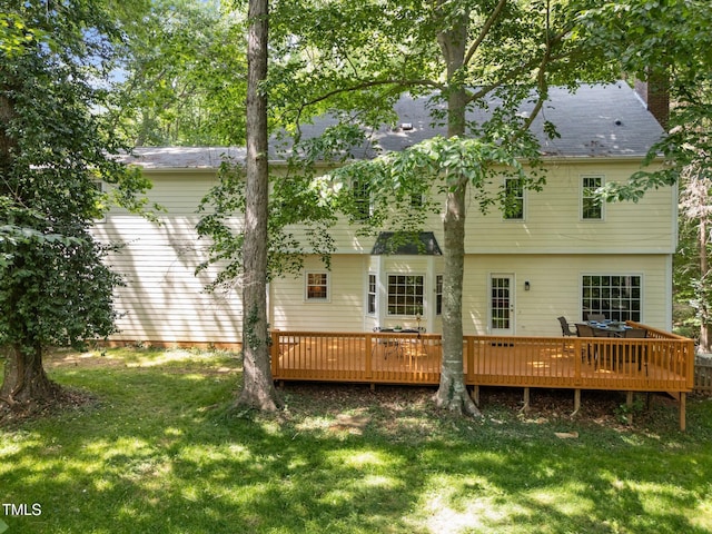 2840 Mattlyn Ct, Raleigh, NC 27613 - rear view of house with a yard, a deck, a chimney, and roof with shingles