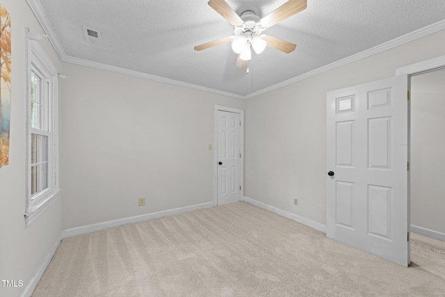 2840 Mattlyn Ct, Raleigh, NC 27613 - empty room featuring a textured ceiling, carpet flooring, ceiling fan, baseboards, and ornamental molding