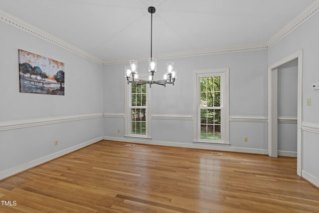 2840 Mattlyn Ct, Raleigh, NC 27613 - unfurnished dining area featuring a chandelier, light wood-style flooring, ornamental molding, and baseboards