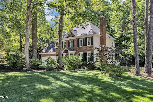 2125 Oakcrest Ct, Raleigh, NC 27612 - colonial home with a chimney and brick siding