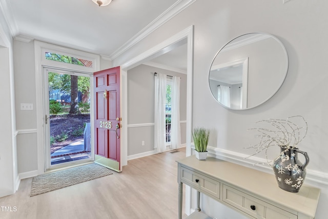 2125 Oakcrest Ct, Raleigh, NC 27612 - foyer featuring light wood-style floors, healthy amount of natural light, crown molding, and baseboards