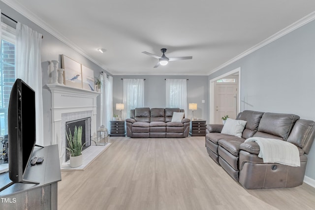 2125 Oakcrest Ct, Raleigh, NC 27612 - living area featuring wood finished floors, a ceiling fan, plenty of natural light, ornamental molding, and a fireplace
