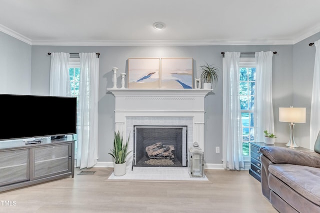 2125 Oakcrest Ct, Raleigh, NC 27612 - living area featuring wood finished floors, a brick fireplace, ornamental molding, baseboards, and recessed lighting
