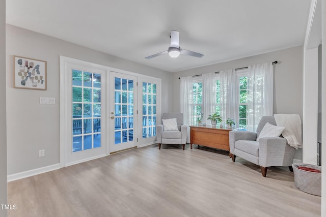 2125 Oakcrest Ct, Raleigh, NC 27612 - sitting room with light wood-style flooring, a ceiling fan, and baseboards
