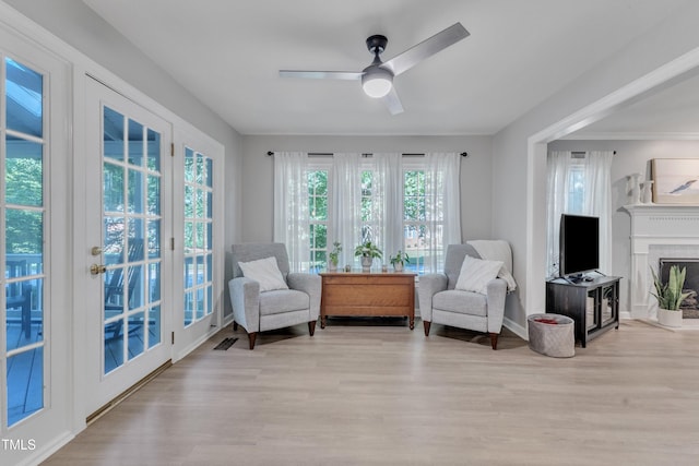 2125 Oakcrest Ct, Raleigh, NC 27612 - living area with a ceiling fan, wood finished floors, and a fireplace