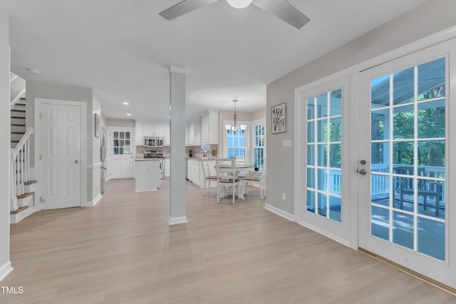 2125 Oakcrest Ct, Raleigh, NC 27612 - living area with stairs, light wood-type flooring, baseboards, a ceiling fan, and recessed lighting