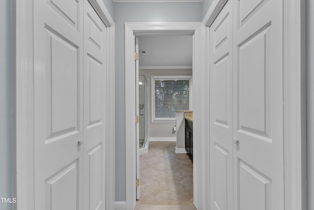 2125 Oakcrest Ct, Raleigh, NC 27612 - hallway featuring crown molding, baseboards, and light tile patterned floors